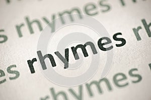 Word rhymes printed on paper macro photo