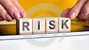 Word risk made with wood building blocks, stock image