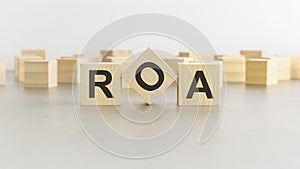 word ROA is made of wooden blocks on white background