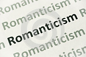 Word Romanticism printed on paper macro