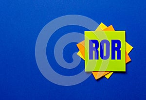 The word ROR is written on bright stickers on a blue background