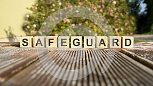 the word safeguard written on the cubes in black letters