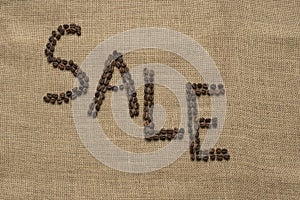 The word SALE from coffee beans on linea material