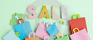 Word Sale and shopping paper bags. Sesonal sale, online deals, discounts, promotion, shopping addiction idea