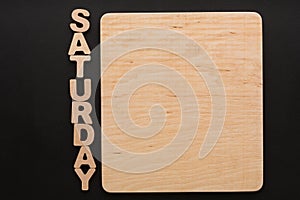 Word Saturday with blank wooden board
