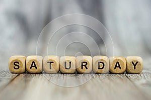 The word Saturday on wooden cubes. Weekday concept