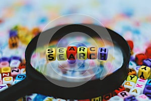 Word `SEARCH` on the magnifying glass