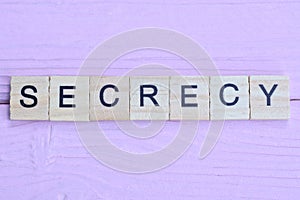 word secrecy from small gray wooden letters