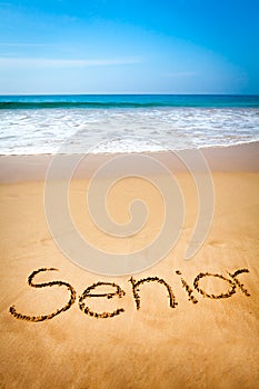 Word Senior Written in Sand, on Tropical Beach