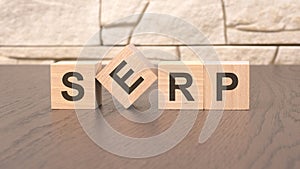 word SERP block wood on wooden table background