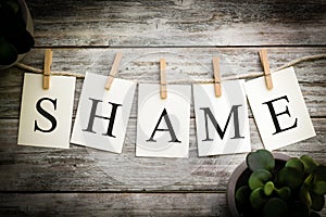 The Word SHAME Concept Printed on Cards