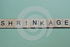 word shrinkage made of small gray wooden letters photo