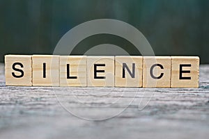 Word silence from wooden letters