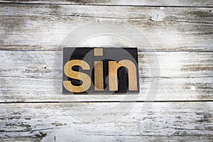 Sin Letterpress Word on Wooden Background