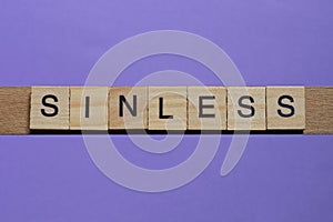 Word sinless made from wooden gray letters photo