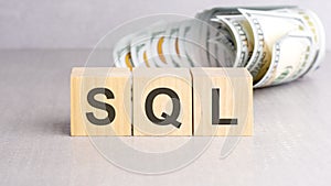word SQL on wooden cubes, grey background