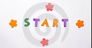 The word start. The word is written in dancing font.
