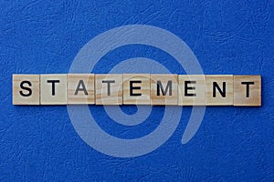 Word statement made from brown wooden letters photo