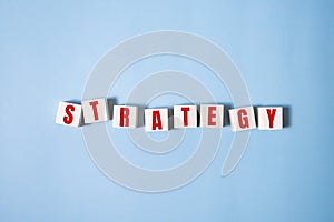 the word strategy on wooden block - business concept