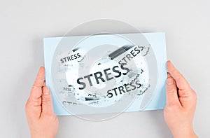 The word stress is standing on a paper, pen with eraser, burnout concept, work life balance, breakdown by exhaustion