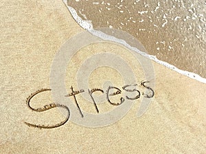 The Word Stress Written in the Sand With Incoming Ocean Wave, Stress Reduction