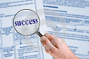 Word Success, magnifying glass in hand