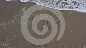 Word SUMMER 2016 writing on sand beach.