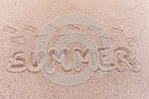 Word summer written on the beach