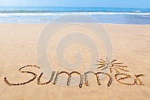 The Word Summer Written in the Sand on a Beach with Drawing of t