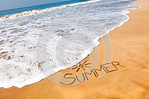 The Word Summer Written in the Sand on a Beach with Drawing of t