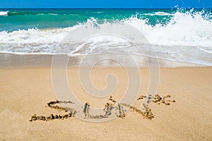 Word sun on beach with sea background