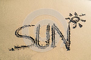 Word sun on beautiful sand