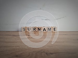 Word surname from wooden blocks