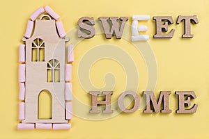 Word sweet home of marshmallow abstract wooden letters.