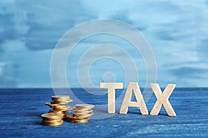 Word TAX and stacked coins