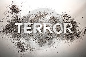 The word terror written in ash as terrorism, war, death, murder, bomb explosion concept