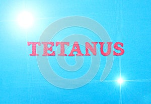 Word tetanus in red letters on a blue background. The concept of a deadly disease of the neural system with convulsions. Treatment