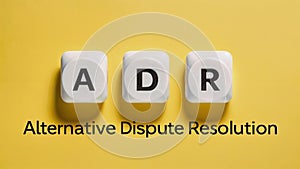 Text text Alternative Dispute Resolution - acronym ADR spelled out with white dice photo