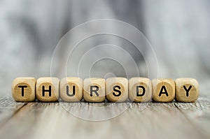 The word Thursday on wooden cubes. Weekday concept