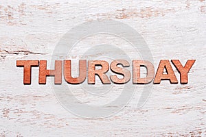 Word thursday in wooden letters