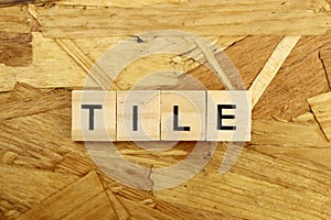word Tile made of wooden blocks on osb background