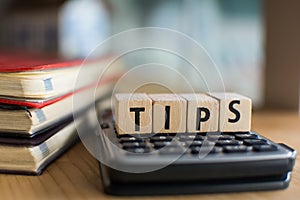 Word of TIPS spelled with colorful wooden alphabet blocks.Selective focus,shallow depth of field