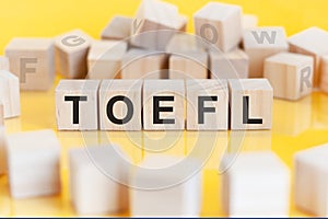 word TOEFL written on wood blocks, concept