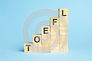 the word toefl is written on a wooden cubes, concept