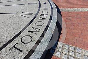 The Word `Tomorrow` Engraved on an Outdoor Stone Sun Dial