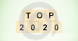 Word top and number twentieth year on small wooden blocks