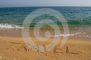 Word travel on the beach.