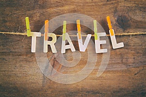 The word TRAVEL made drom wooden letters