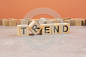 Word Trend made with wood blocks. text is written in black letters, light background