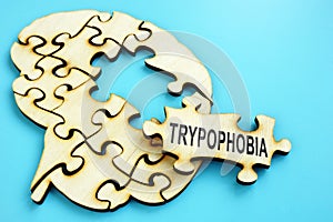 Word Trypophobia on the puzzle with brain shape